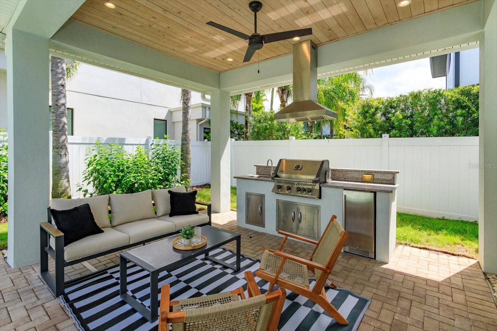 533 COUNTRY CLUB DRIVE, Winter Park, FL 32789 Brick paver lanai with summer kitchen with Napoleon gas grill, beverage fridge and vent hood
