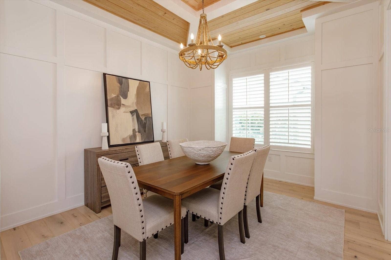 533 COUNTRY CLUB DRIVE, Winter Park, FL 32789 Dining room with wainscoting and tray ceiling
