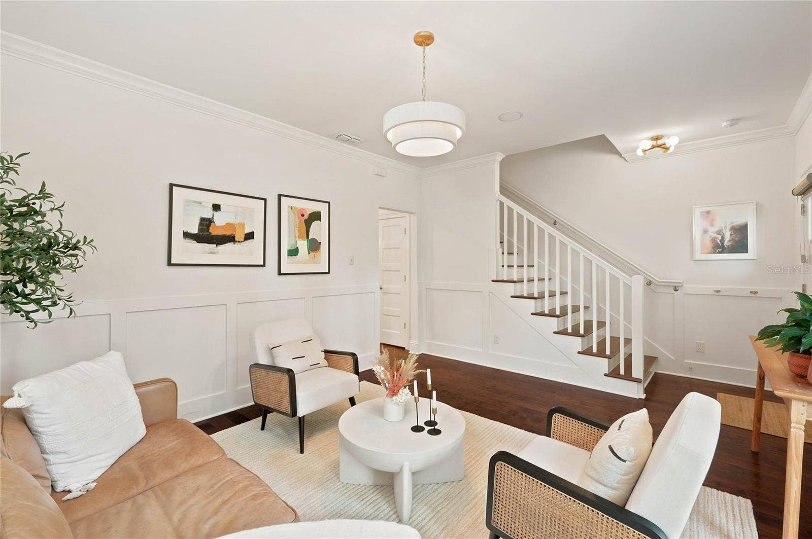 1707 ASHER LANE, Orlando, FL 32803 Custom wainscoting, detail moldings and designer light fixture all add to the character of the space