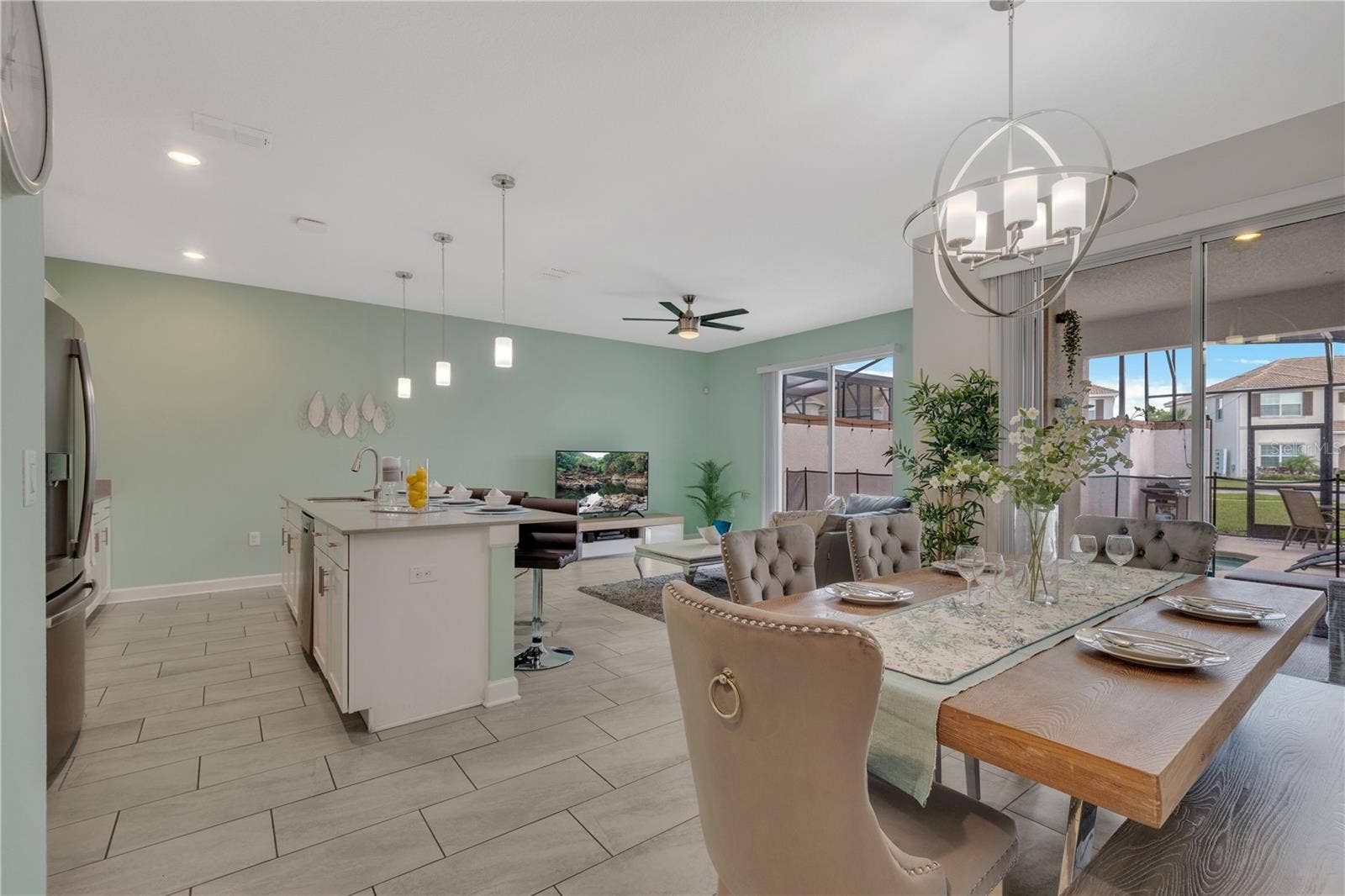 1557 SANDBAGGER DRIVE, Davenport, FL 33896 Open view of Dining Room and Kitchen