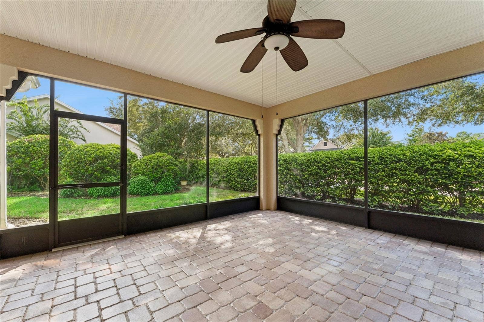 202 DRUMMOND LANE, Deland, FL 32724 18' x 16'6" Screen enclosed covered patio w/ privacy landscaping
