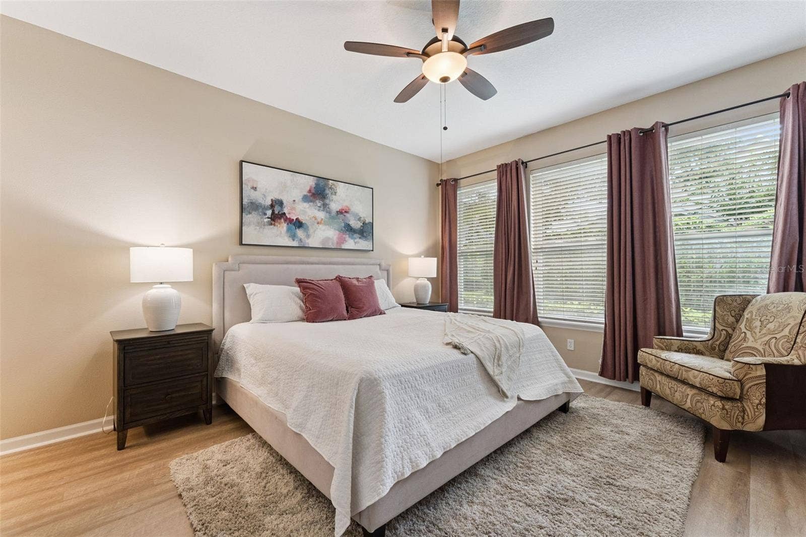 202 DRUMMOND LANE, Deland, FL 32724 12'6" x 15' Primary Bedroom w/ luxury vinyl floor & a ceiling fan