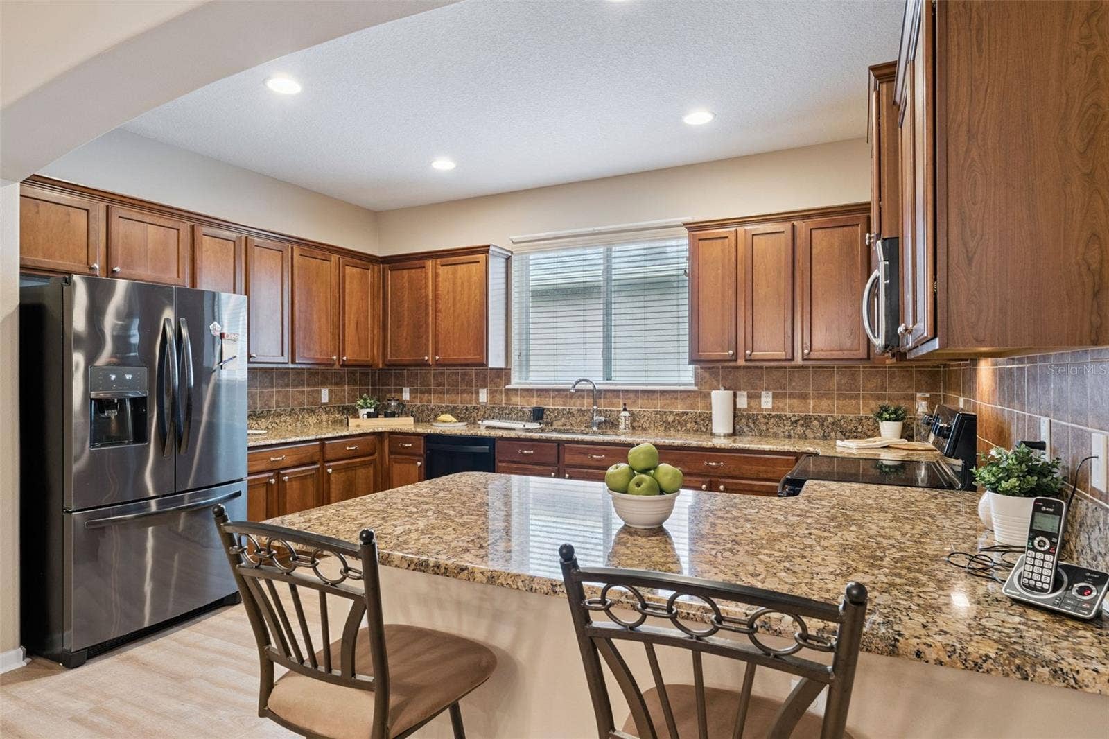 202 DRUMMOND LANE, Deland, FL 32724 Kitchen w/ French door style refrigerator, electric glass top range & a breakfast bar