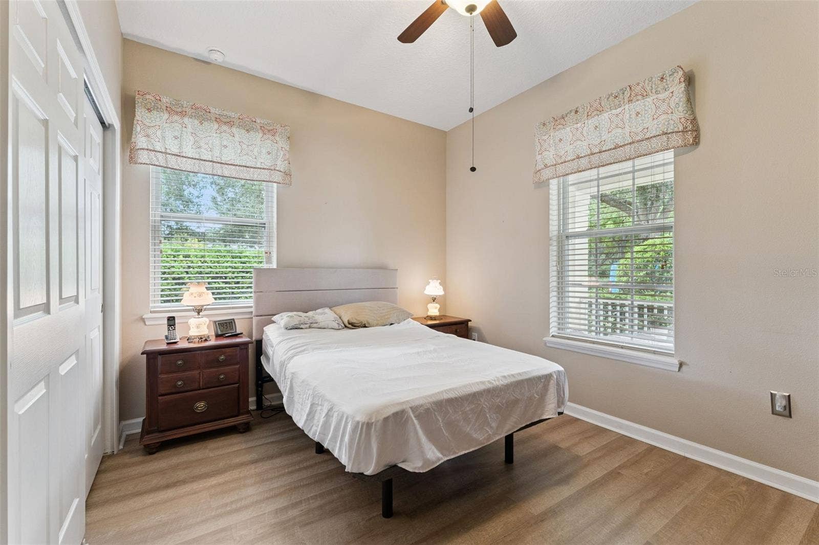 202 DRUMMOND LANE, Deland, FL 32724 12'6" x 10' Bedroom #2 w/ a luxury vinyl floor & a ceiling fan