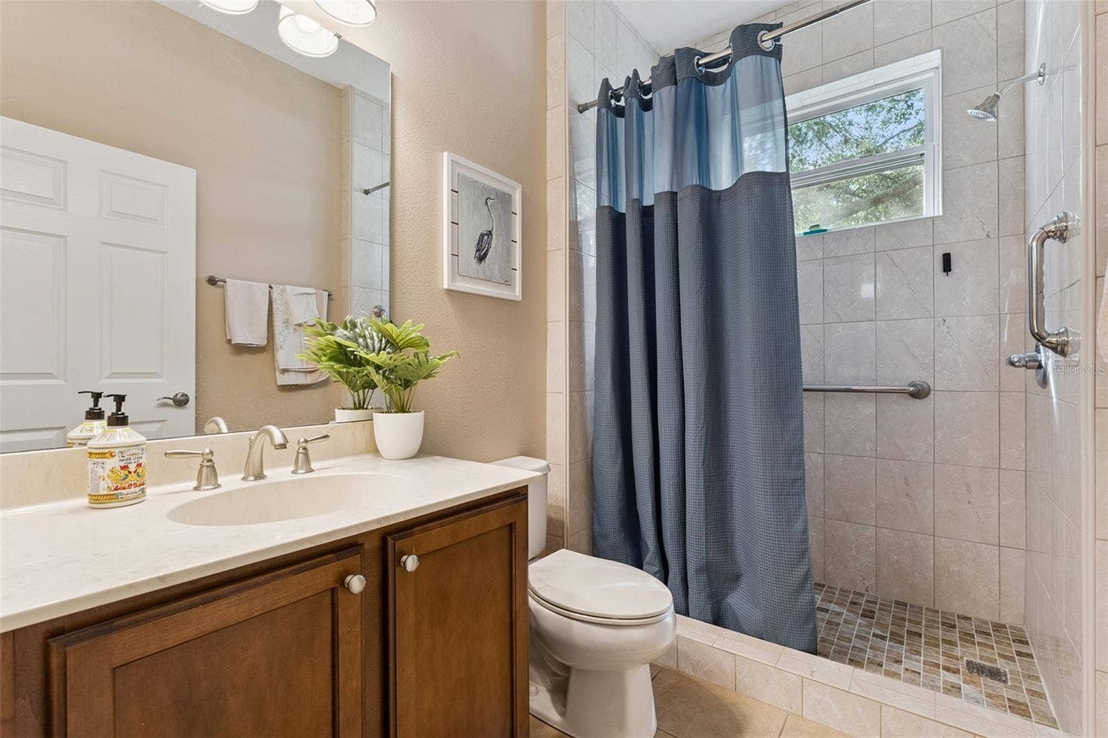 202 DRUMMOND LANE, Deland, FL 32724 Guest Bathroom w/ a walk-in shower & grab bars