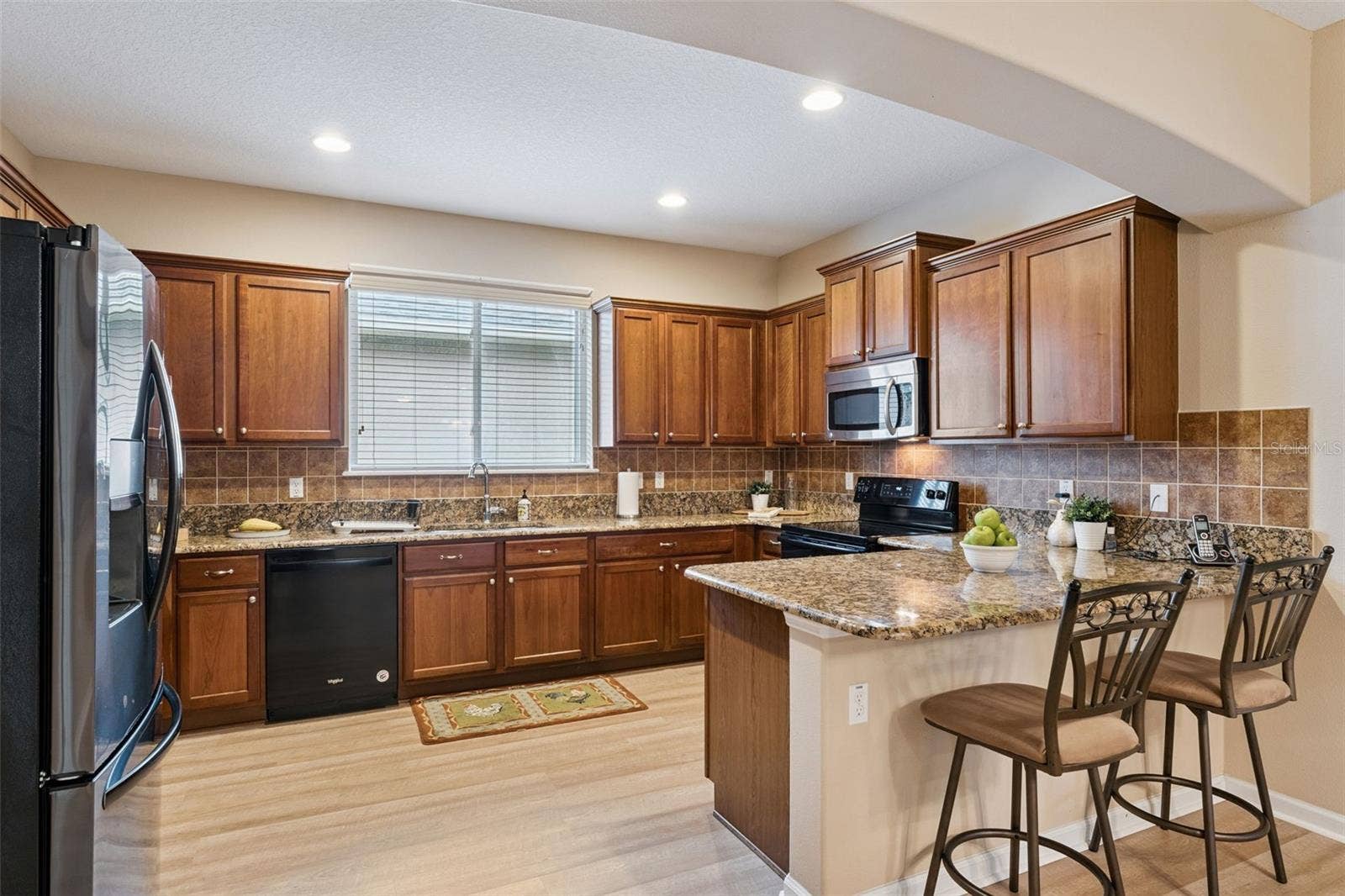 202 DRUMMOND LANE, Deland, FL 32724 11' x 14'6" Kitchen w/ 36" Maple cabinets, tile backsplash & granite countertops