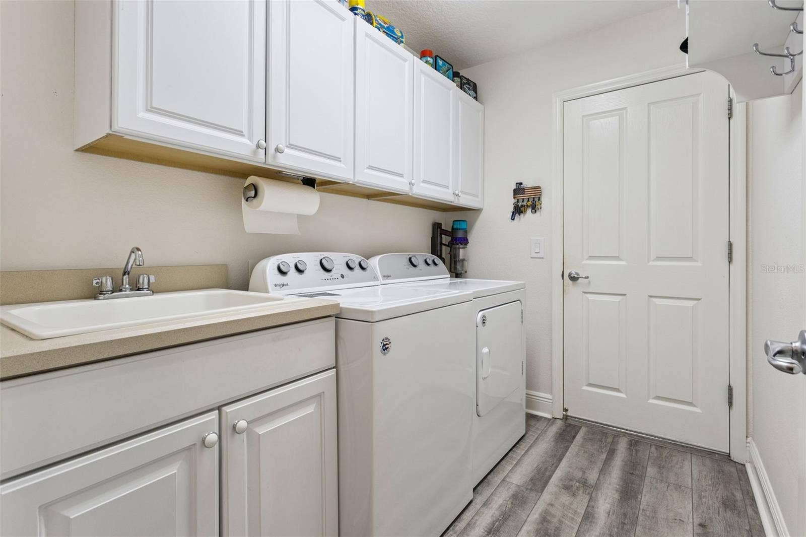 842 LUCKY LANE, The Villages, FL 32162 Indoor laundry room with utility sink