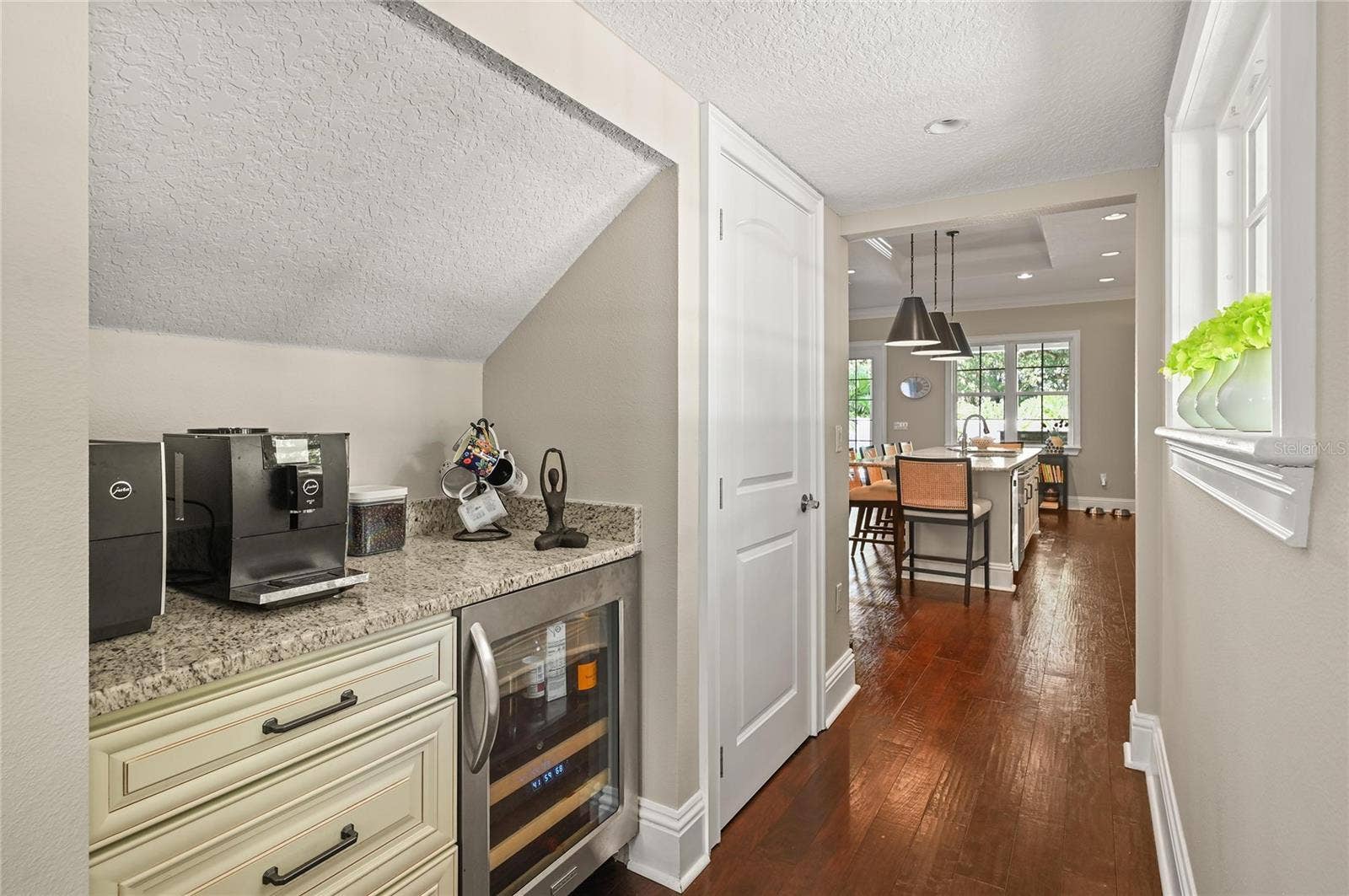 1951 WINTER PARK ROAD, Winter Park, FL 32789 There is a coffee bar and wine fridge tucked in next to the kitchen.
