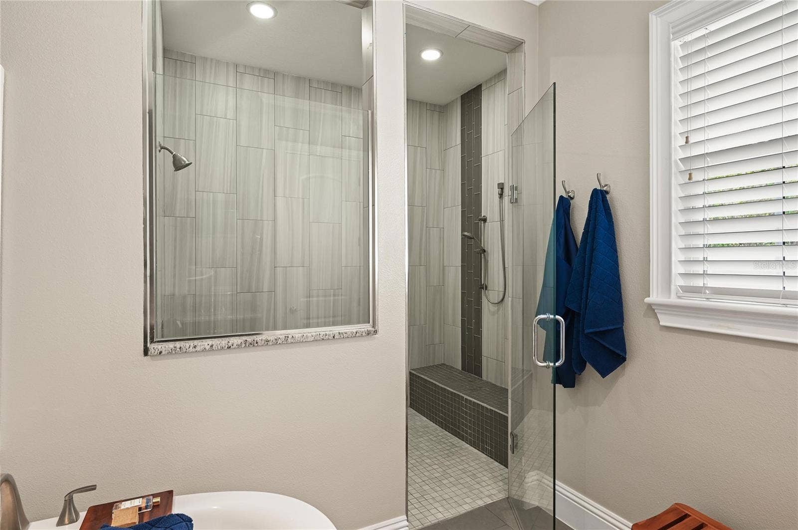 1951 WINTER PARK ROAD, Winter Park, FL 32789 The oversized shower was thoughtfully designed with a handy bench seat and controls located just inside the shower opening.