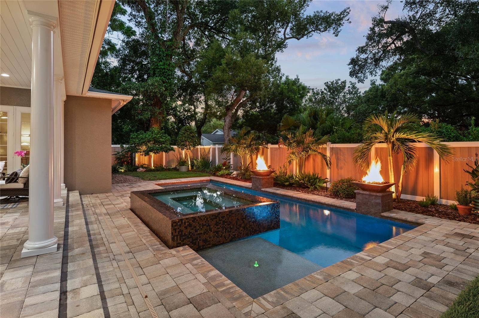 1951 WINTER PARK ROAD, Winter Park, FL 32789 Landscape lighting creates a cozy, relaxing atmosphere at nightfall.
