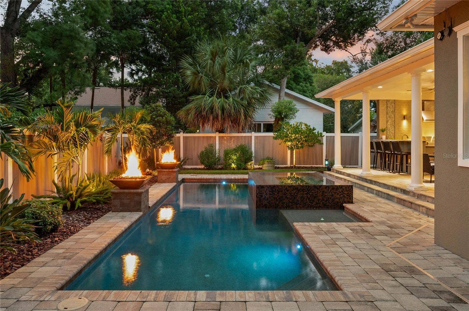 1951 WINTER PARK ROAD, Winter Park, FL 32789 Lovely pavers flow from the patio to the deck for a finished look.