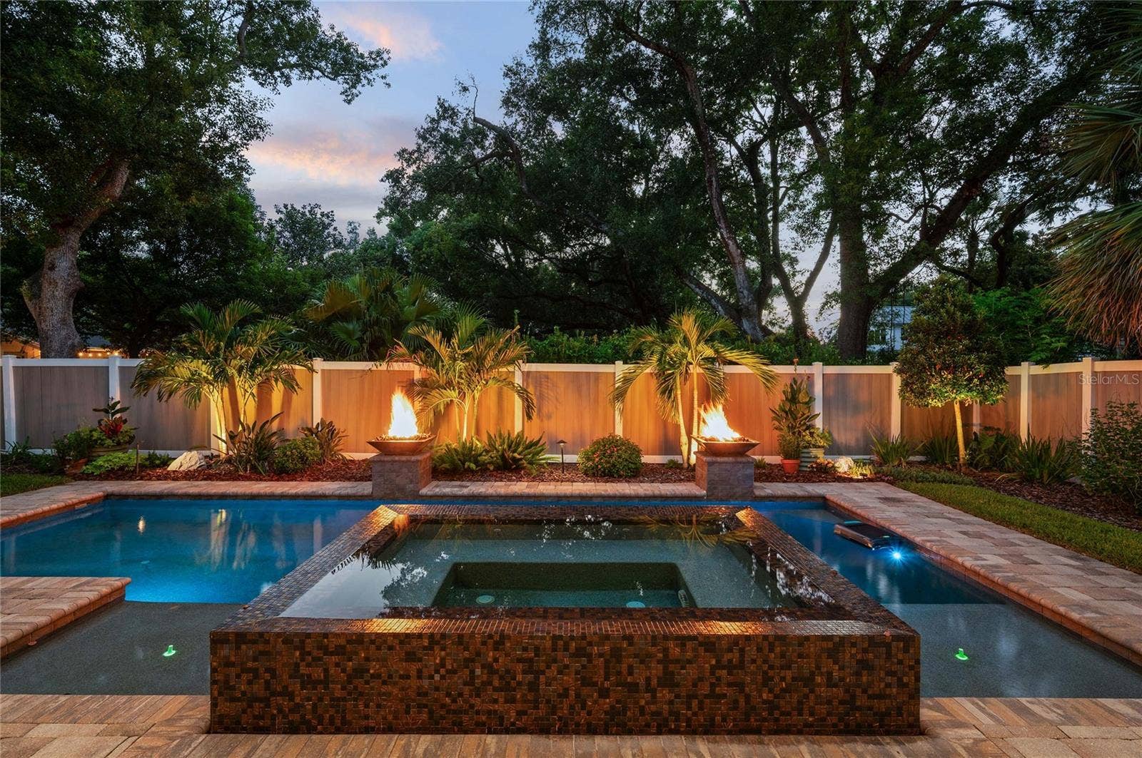 1951 WINTER PARK ROAD, Winter Park, FL 32789 Twilight is magical overlooking the spill-over spa with gas firepits.