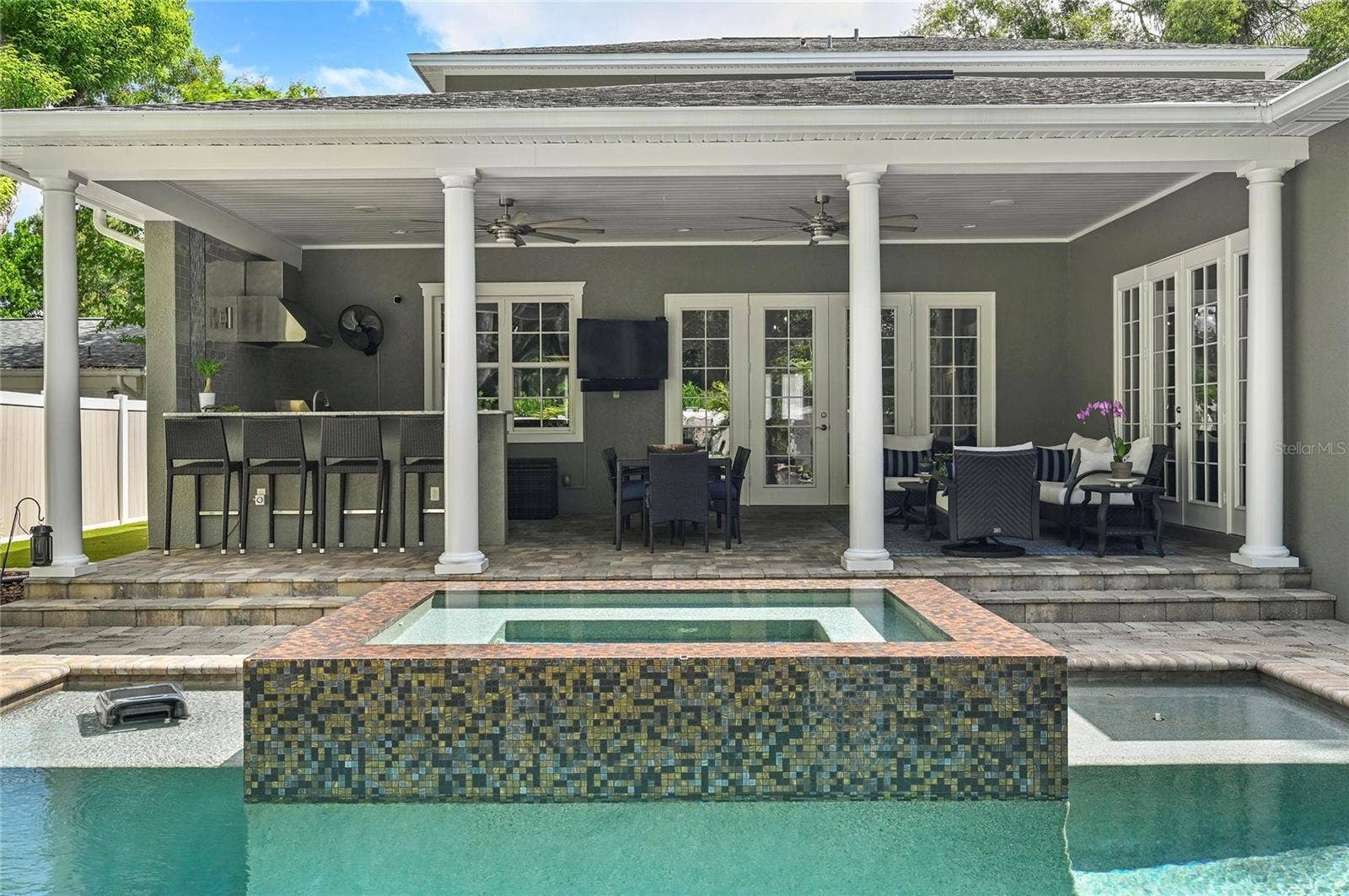 1951 WINTER PARK ROAD, Winter Park, FL 32789 Accented by fire pits, the zen pool design makes lingering on the porch a delight.