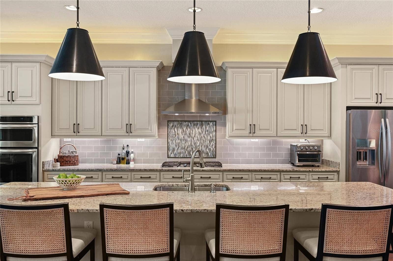 1951 WINTER PARK ROAD, Winter Park, FL 32789 Pendant lights give a sense of warmth and highlight the beauty of the stone counter top.