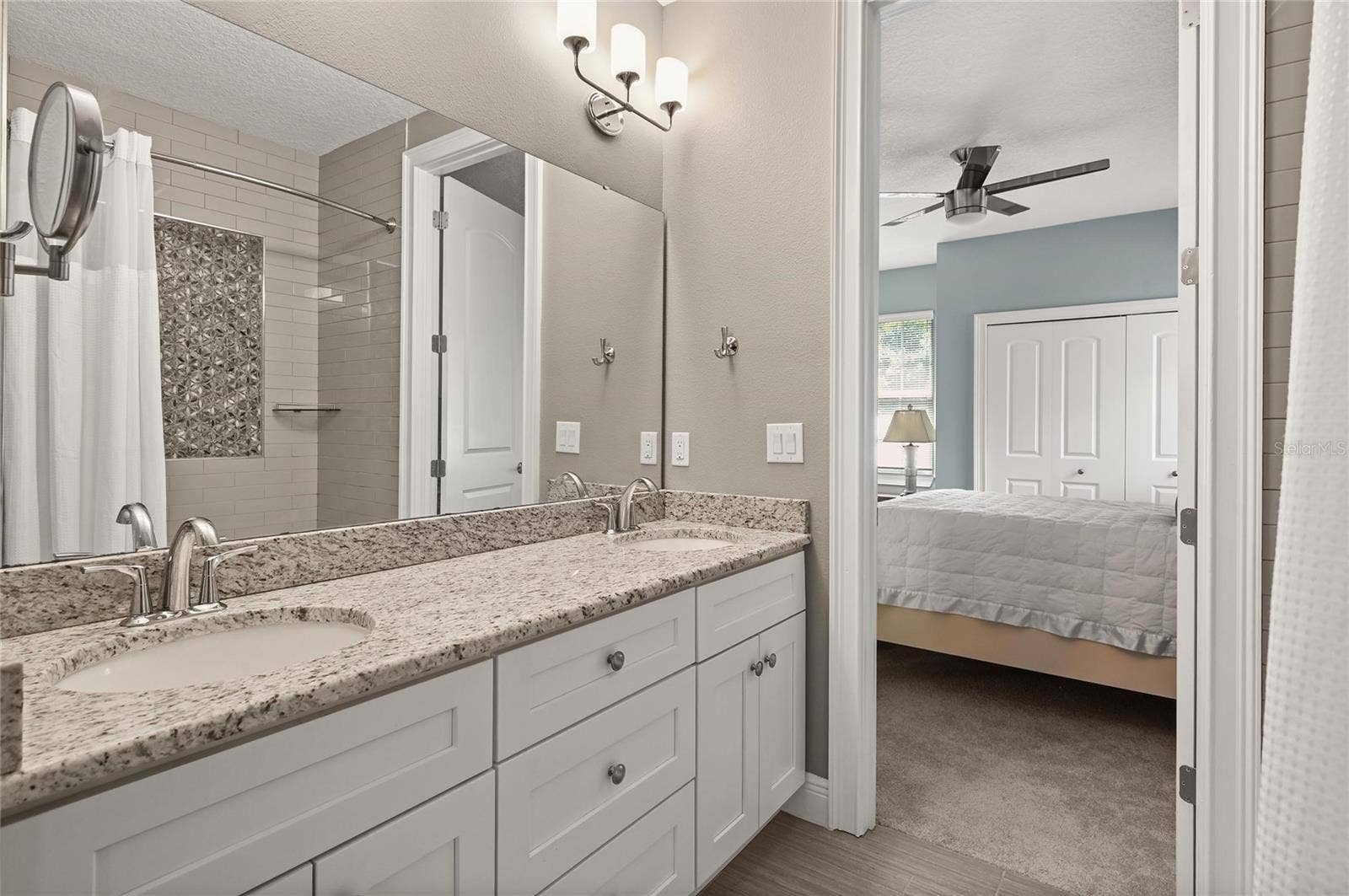 1951 WINTER PARK ROAD, Winter Park, FL 32789 The bathroom features double sinks and a linen storage closet.