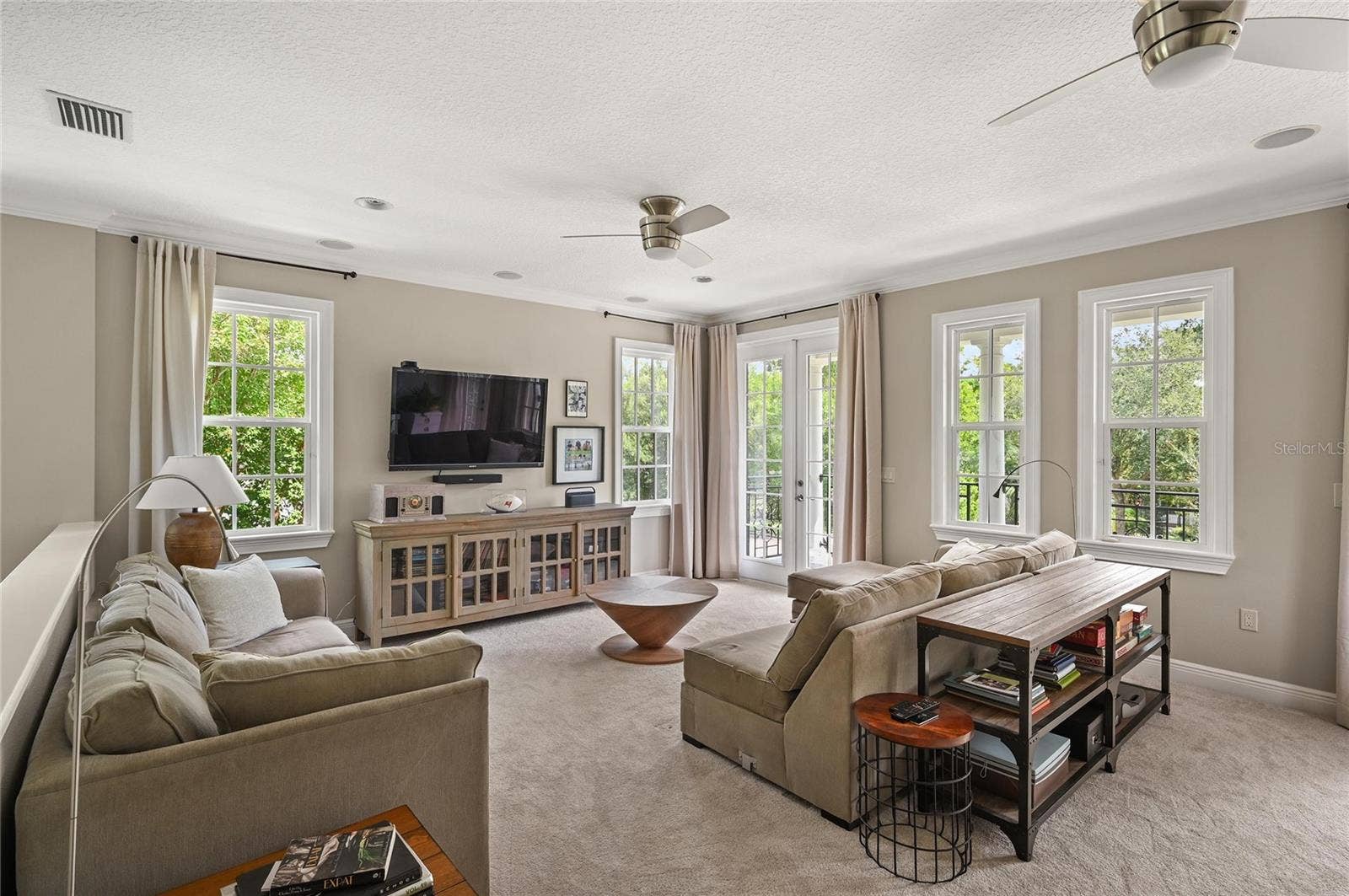 1951 WINTER PARK ROAD, Winter Park, FL 32789 Double french doors let the light in and show off the surrounding tree canopy.