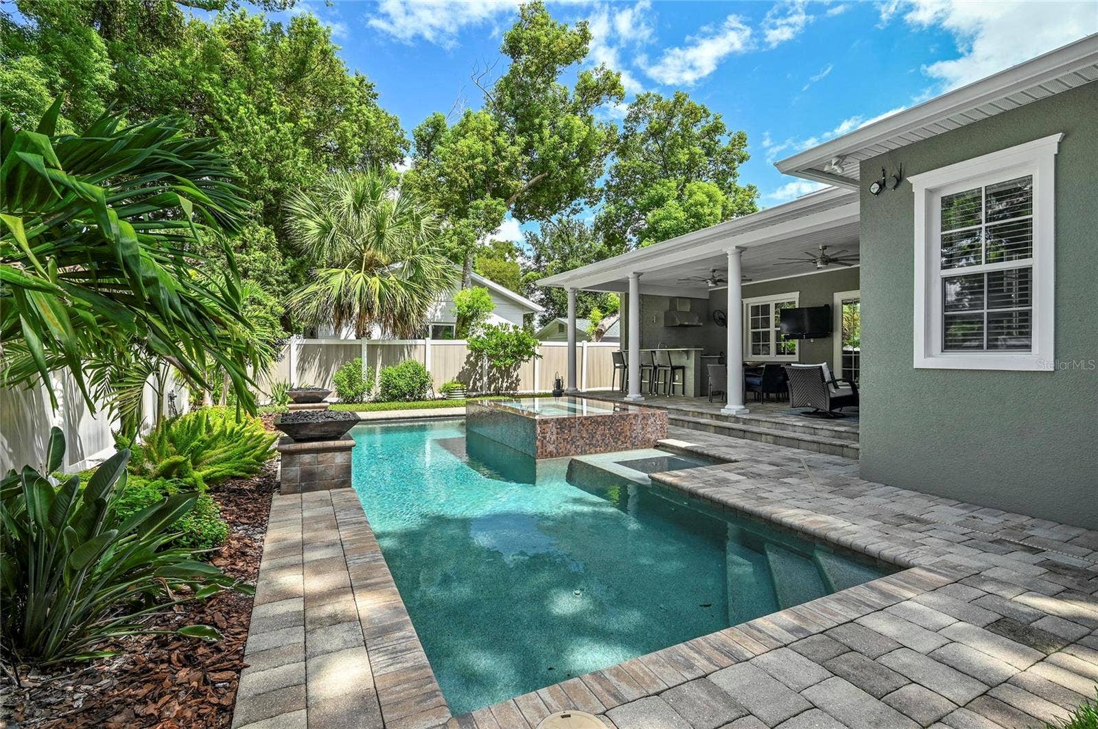 1951 WINTER PARK ROAD, Winter Park, FL 32789 The salt water pool features a heated spill-over spa and paver deck.