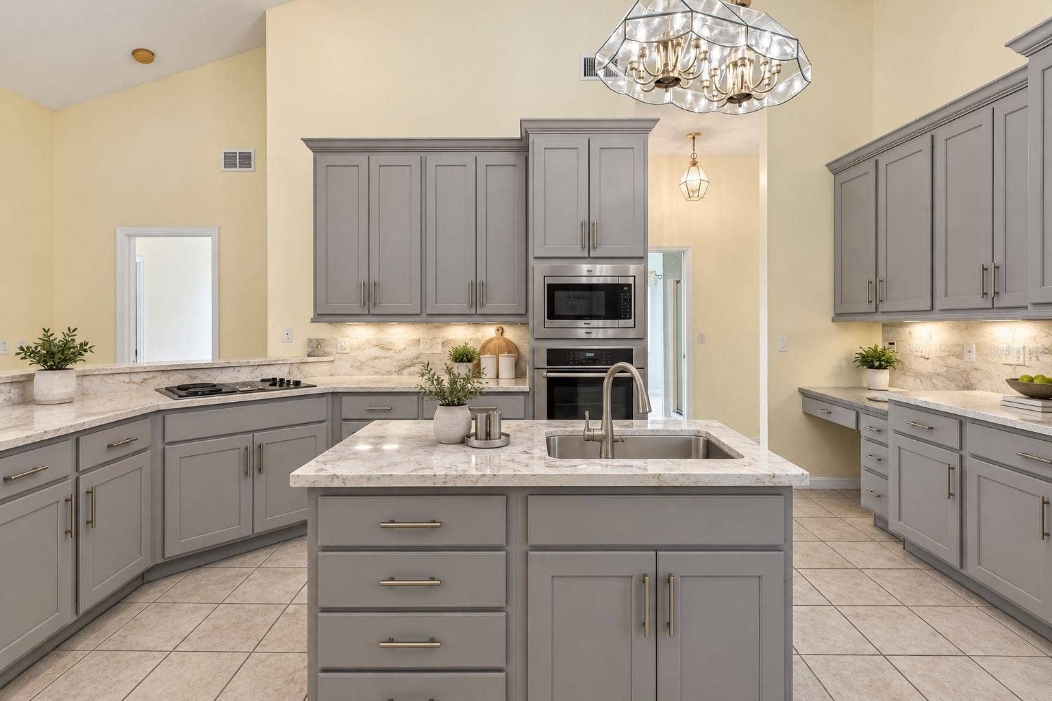 Virtually Changed to show remodel with new counters and painted existing cabinets.