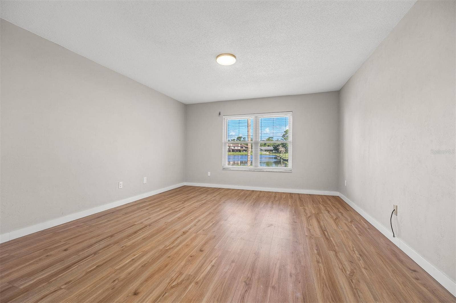 107 DEER LAKE CIRCLE, Ormond Beach, FL 32174 Primary Bedroom with Lake View
