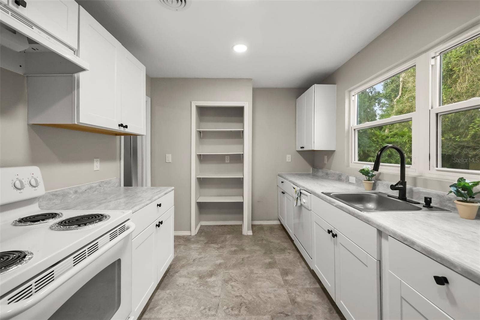 Galley kitchen with plenty of counter space and storage