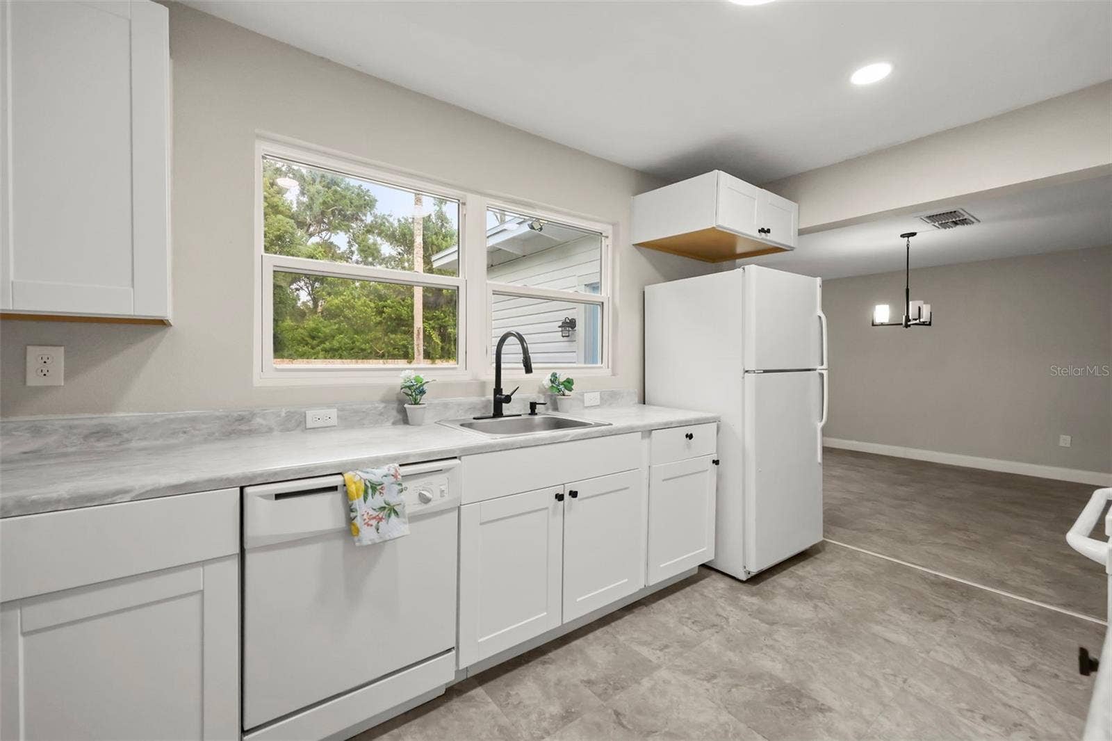 Kitchen overlooking the fully fenced backyard