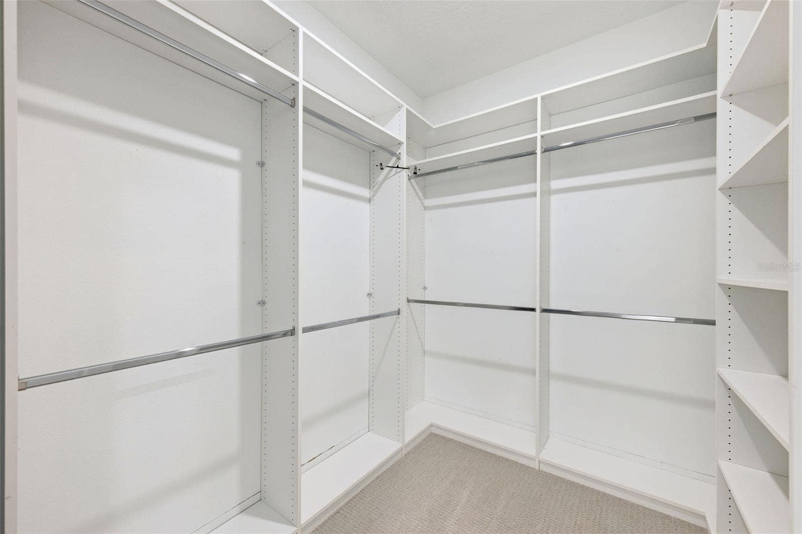 Primary bedroom walk-in custom closet