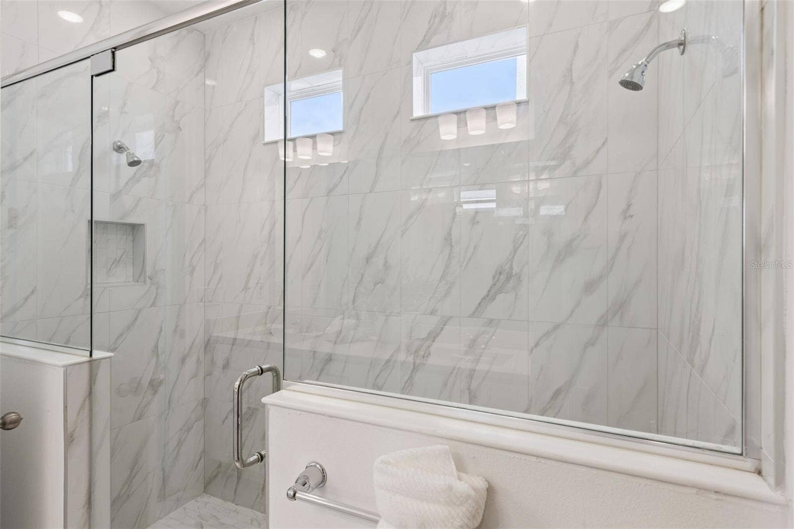 Walk-in shower with three shower heads