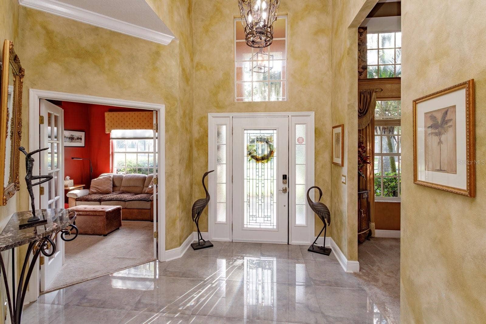 536 AVON GLADE PLACE, Sanford, FL 32771 Foyer with bdrm 4 on left and dining room on right