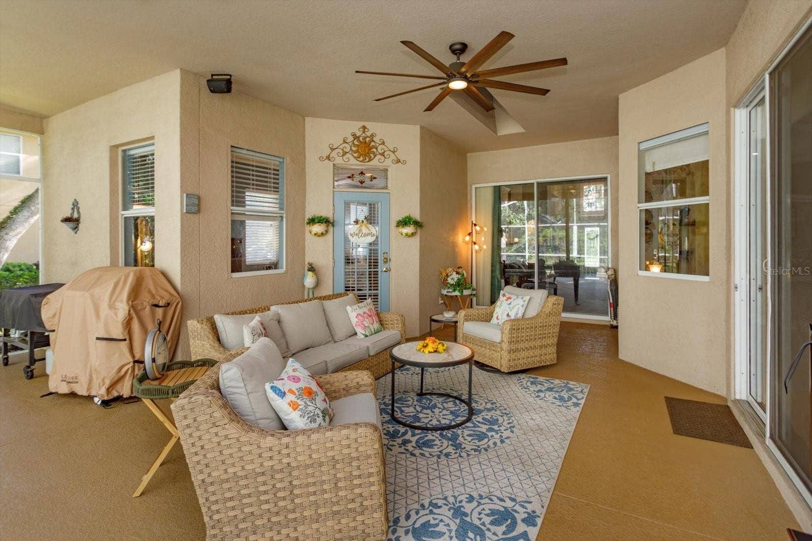 536 AVON GLADE PLACE, Sanford, FL 32771 covered lanai open to living room, family room, and primary suite