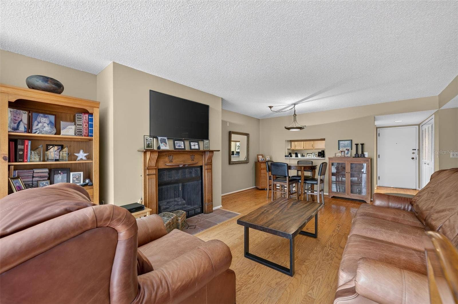250 CAROLINA AVENUE, #202, Winter Park, FL 32789 Living Room With Wood Burning Fireplace