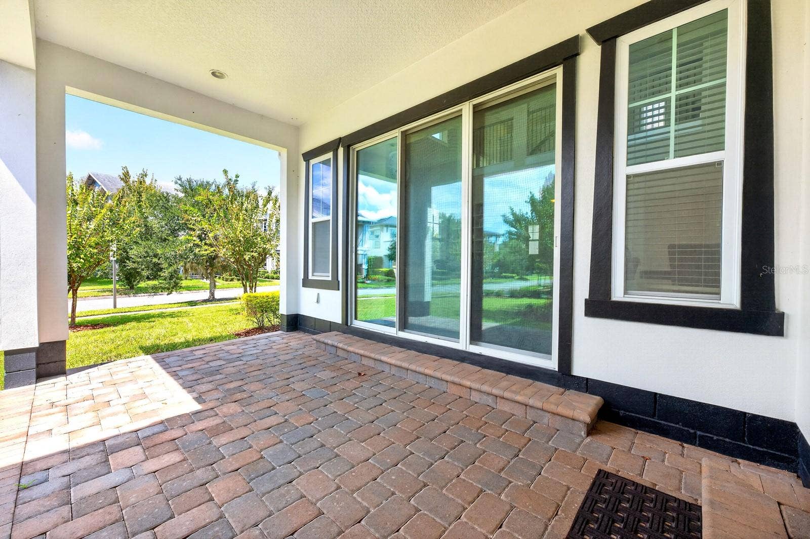 9024 NEHER STREET, Orlando, FL 32827 A wall of sliding glass doors creates the ultimate indoor/outdoor living.