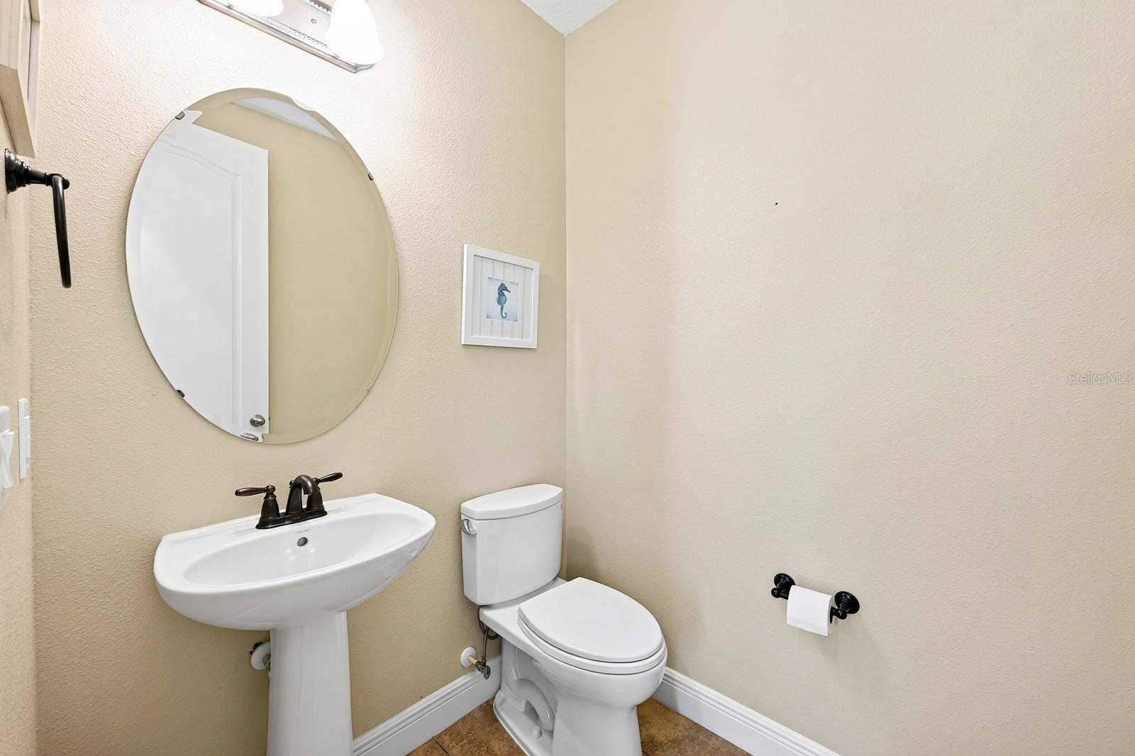 9024 NEHER STREET, Orlando, FL 32827 Convenient main floor half bath.