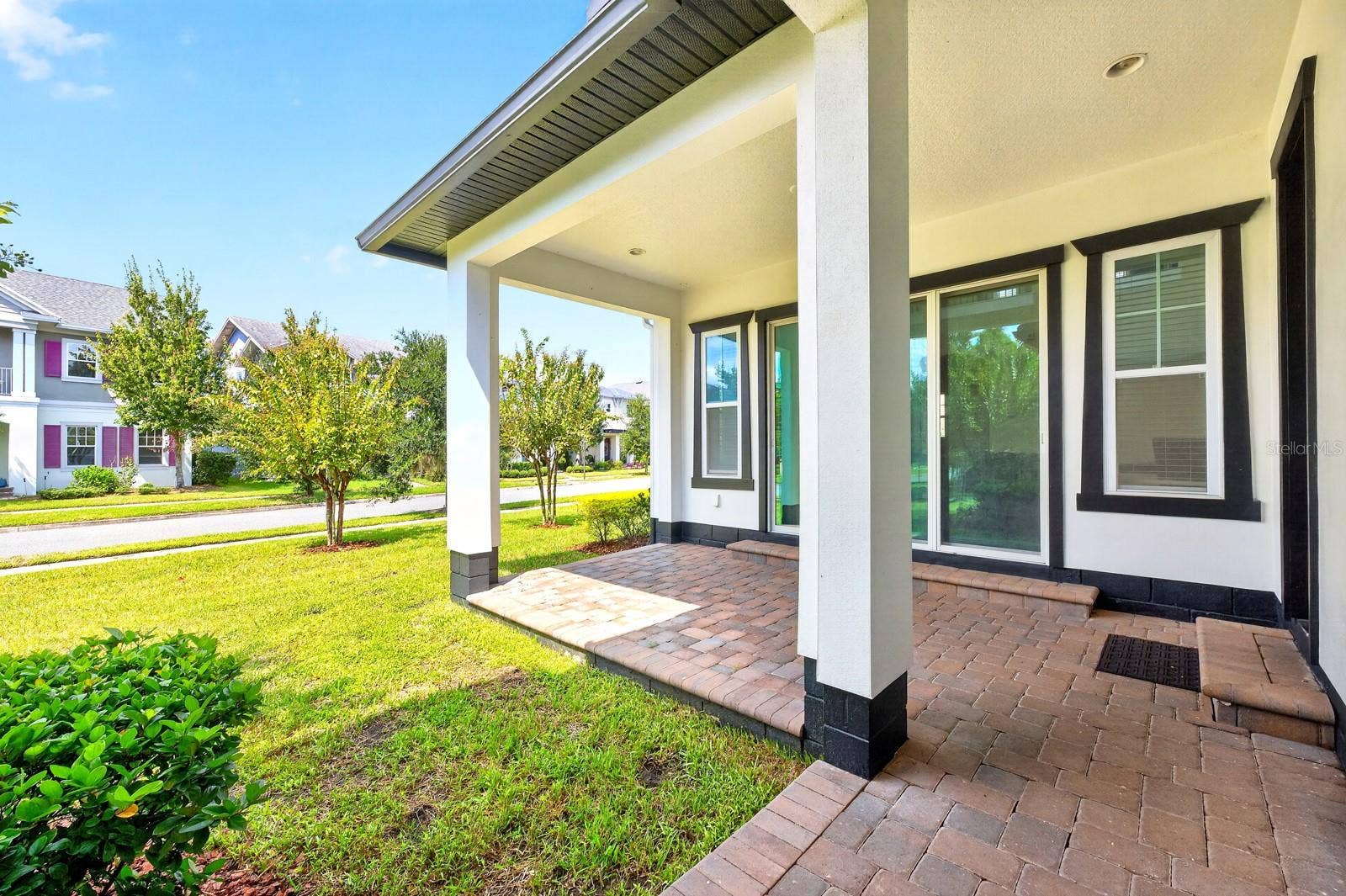 9024 NEHER STREET, Orlando, FL 32827 Covered paver lanai.