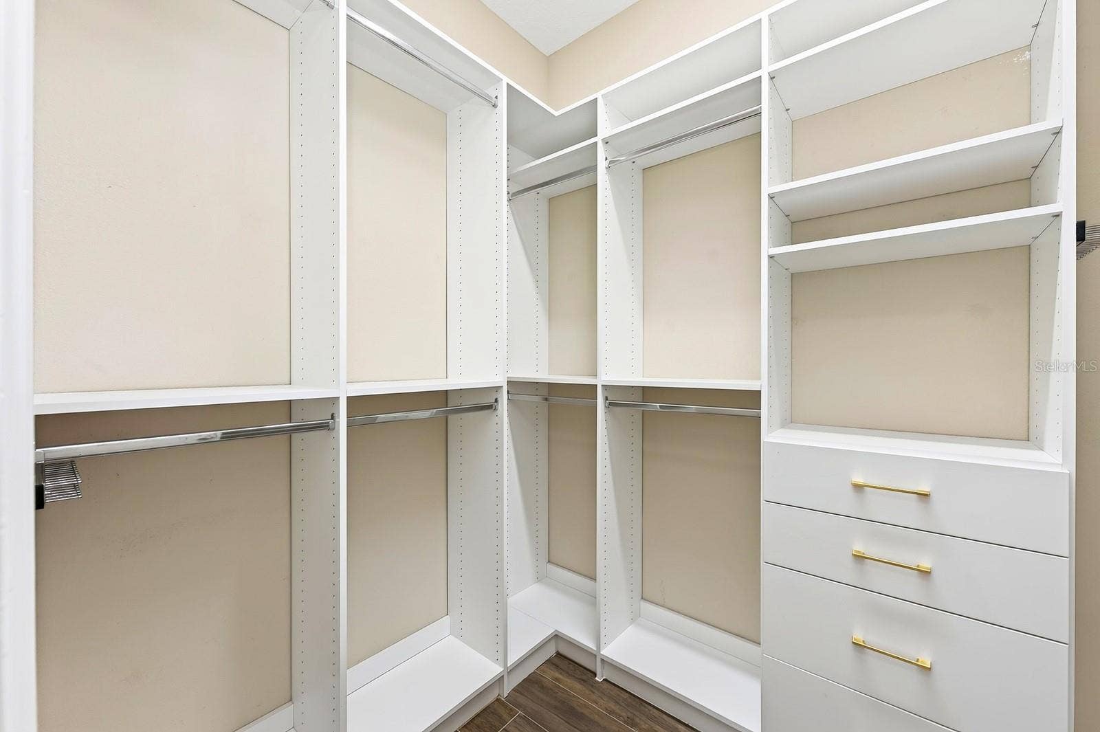 9024 NEHER STREET, Orlando, FL 32827 Primary suite walk-in closet with custom storage.