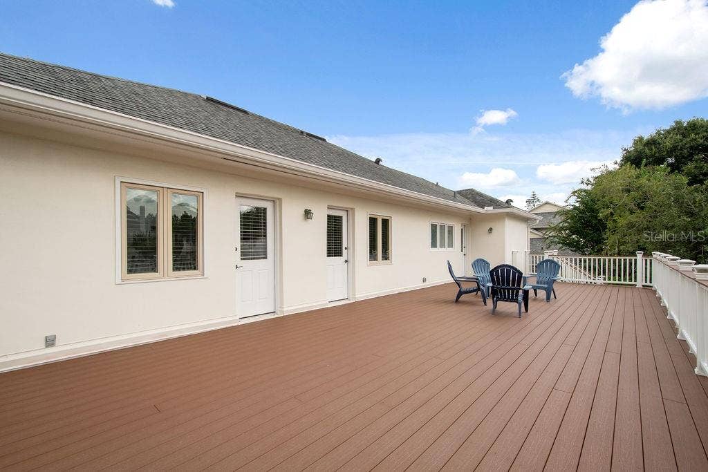 555 E LAKE SUE AVENUE, Winter Park, FL 32789 Upper deck runs the length of the home with access from upstairs bedrooms.