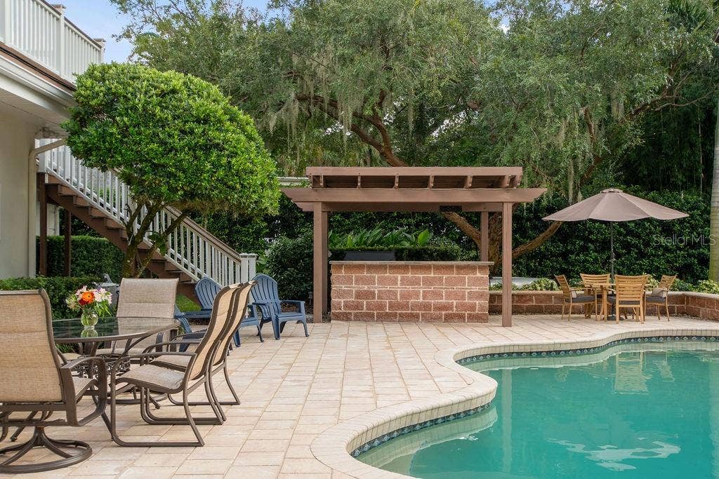 555 E LAKE SUE AVENUE, Winter Park, FL 32789 Exterior staircase leading to pool deck.