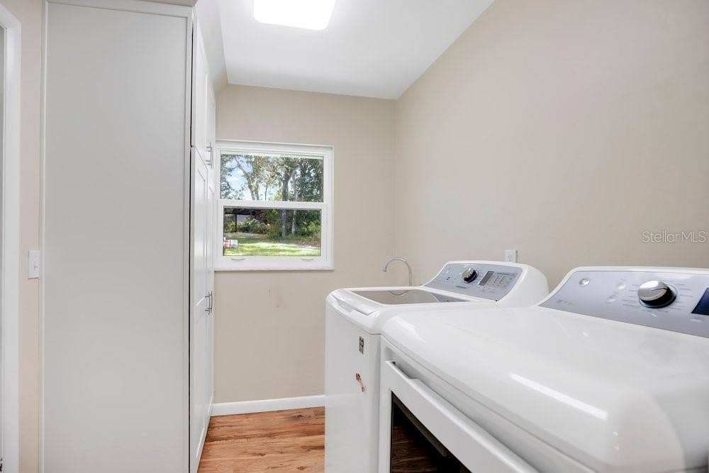 2391 BANANA STREET, Deland, FL 32720 INDOOR LAUNDRY ROOM WITH PANTRY AND DEEP SINK