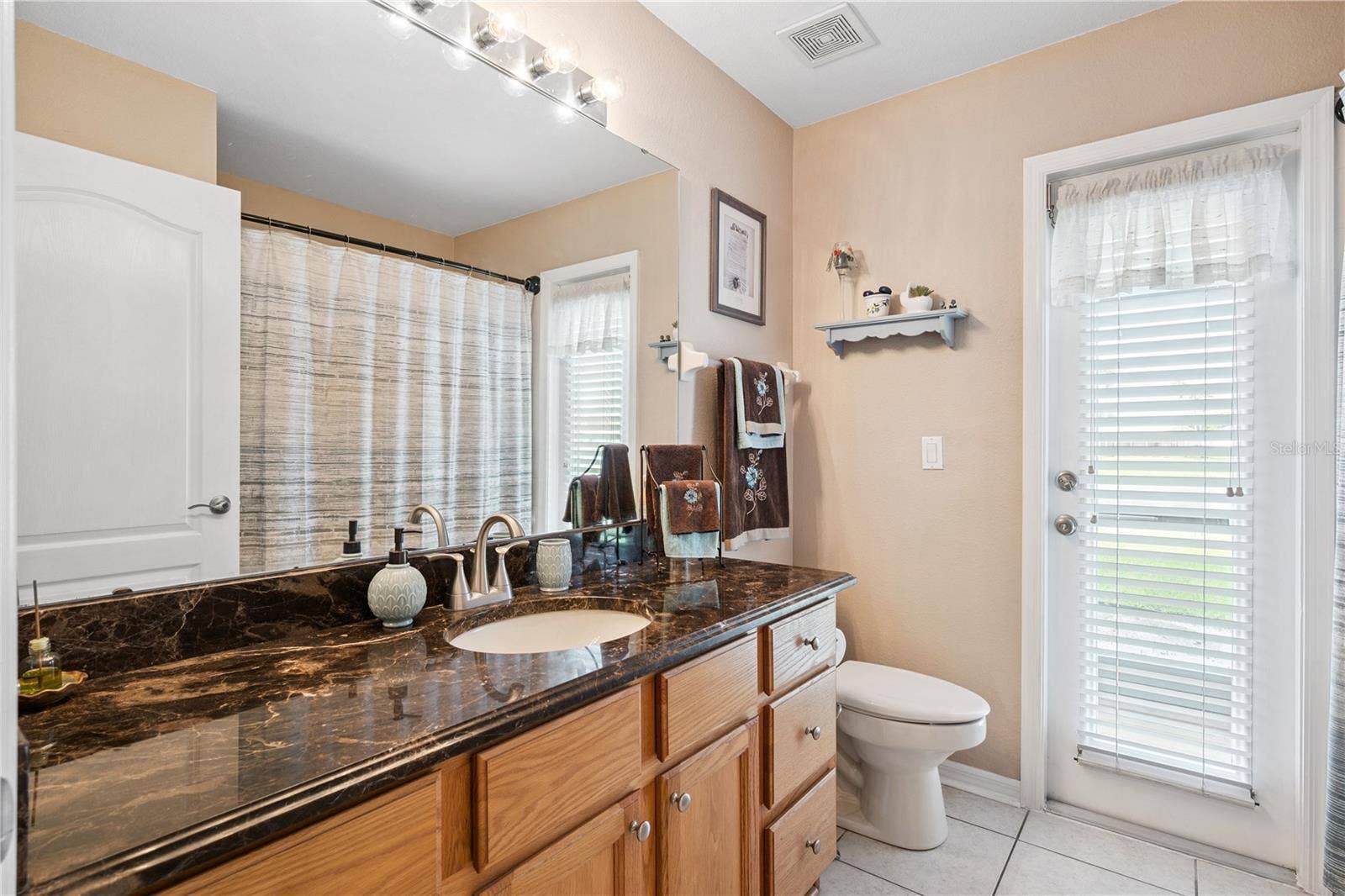 3828 BROOKMYRA DRIVE, Orlando, FL 32837 Guest and Pool bathroom- more marble