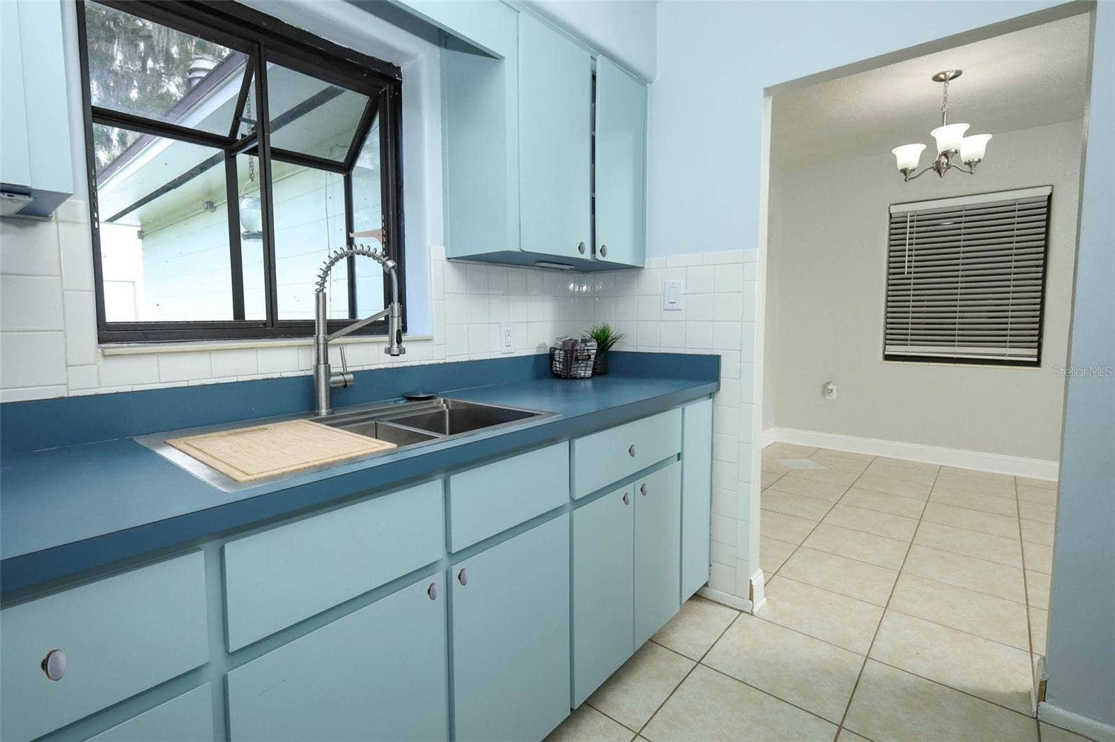 506 S ELSASSER STREET, Deland, FL 32720 Kitchen with Window Box and Dining Room