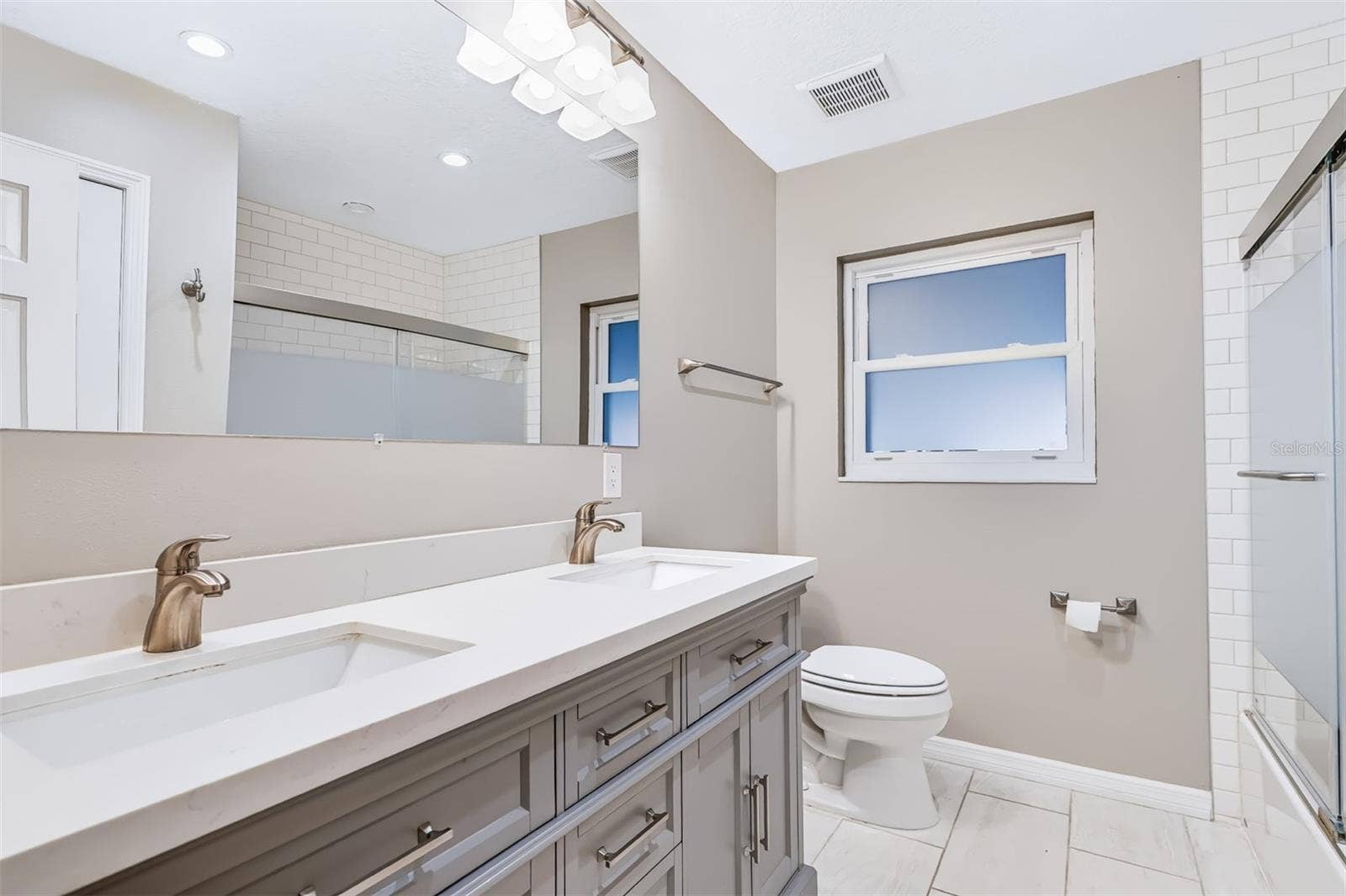 624 DUNRAVEN DRIVE, Winter Park, FL 32792 Hallway Bathroom with Dual Sink Granite Vanity with Soft-Close Drawers & Cabinets