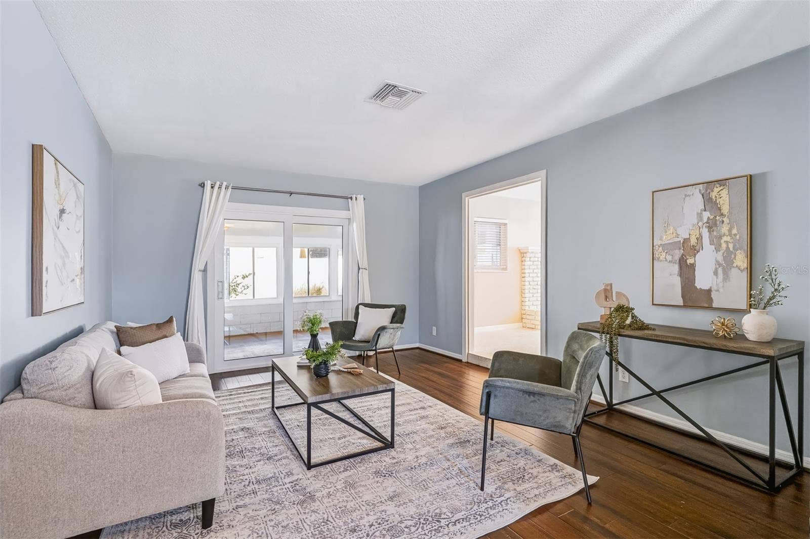 624 DUNRAVEN DRIVE, Winter Park, FL 32792 Family Room with Sliders Leading to Enclosed Lanai