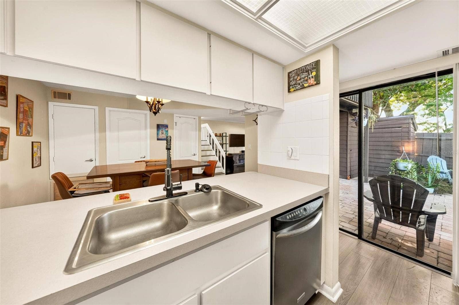 618 OLYMPIC DRIVE, #6A, Ocoee, FL 34761 Kitchen with courtyard access through sliding glass doors.