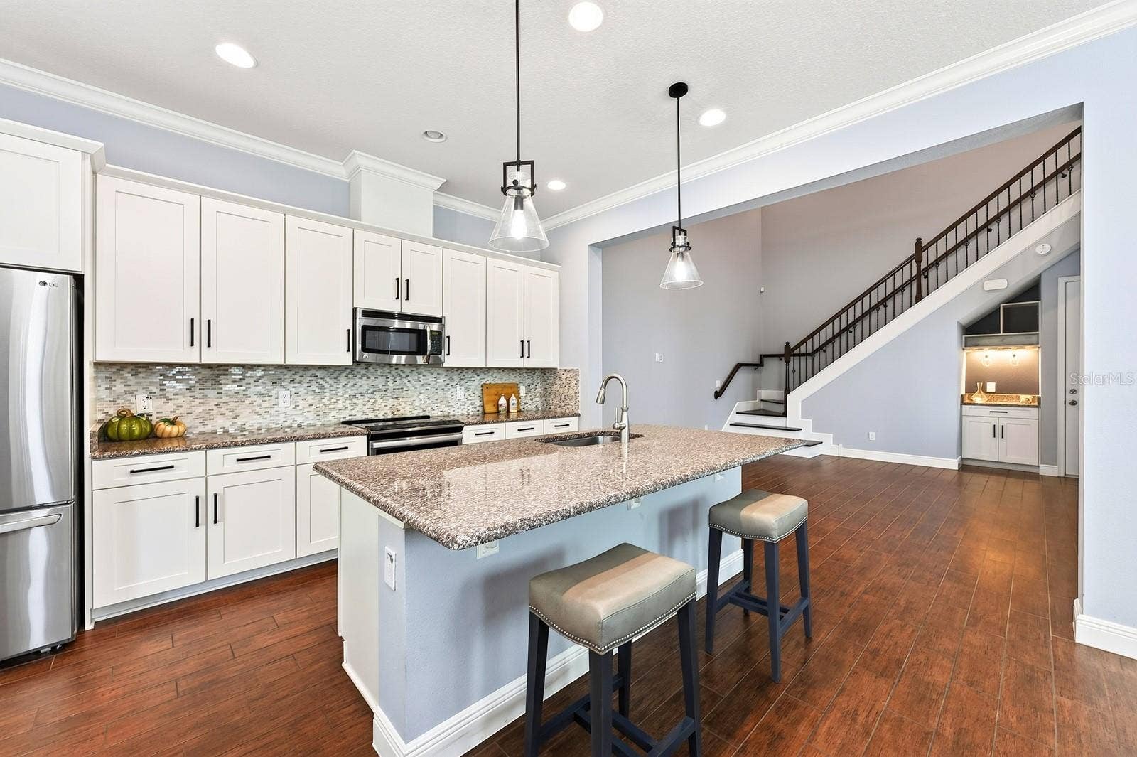 14061 WALCOTT AVENUE, Orlando, FL 32827 Seamless flow into the two story living room.