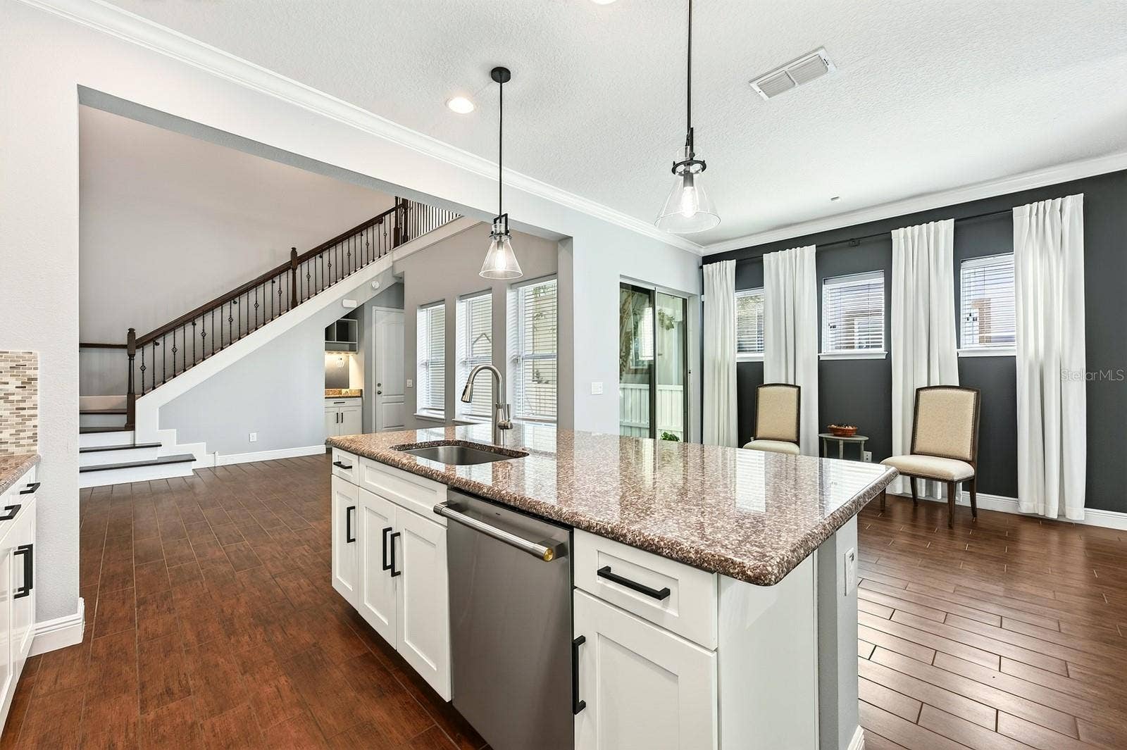 14061 WALCOTT AVENUE, Orlando, FL 32827 The large island makes it easy to entertain.