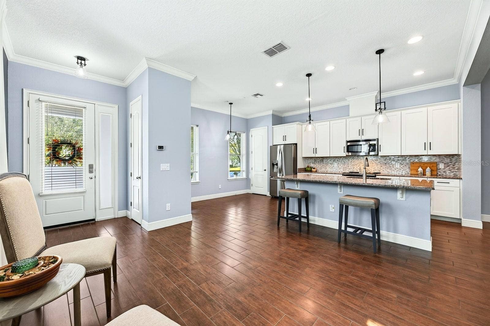 14061 WALCOTT AVENUE, Orlando, FL 32827 Kitchen is open to flexible dining spaces.