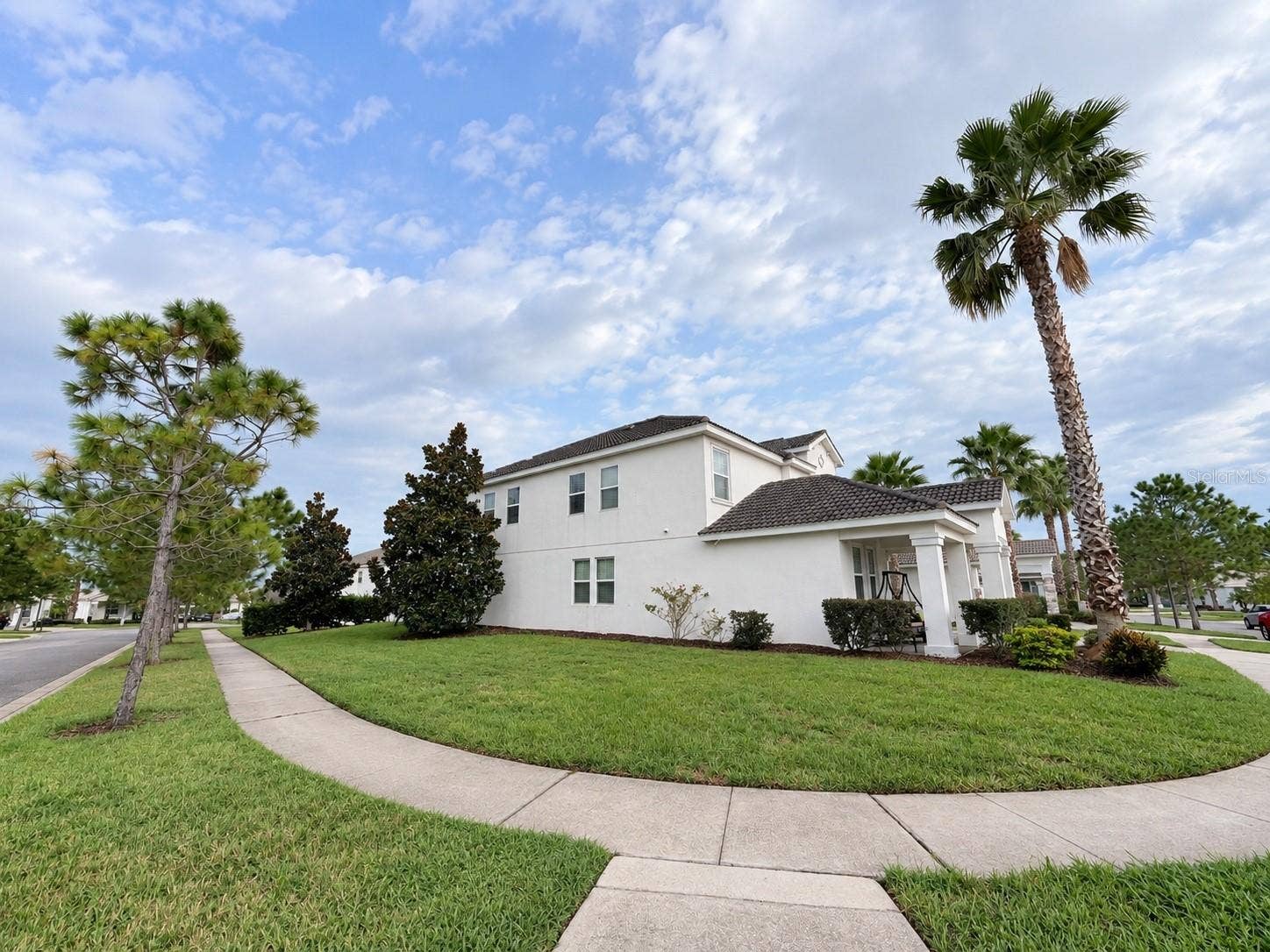 1516 BUNKER DRIVE, Davenport, FL 33896 Generous corner homesite provides additional outdoor space and an open feel.