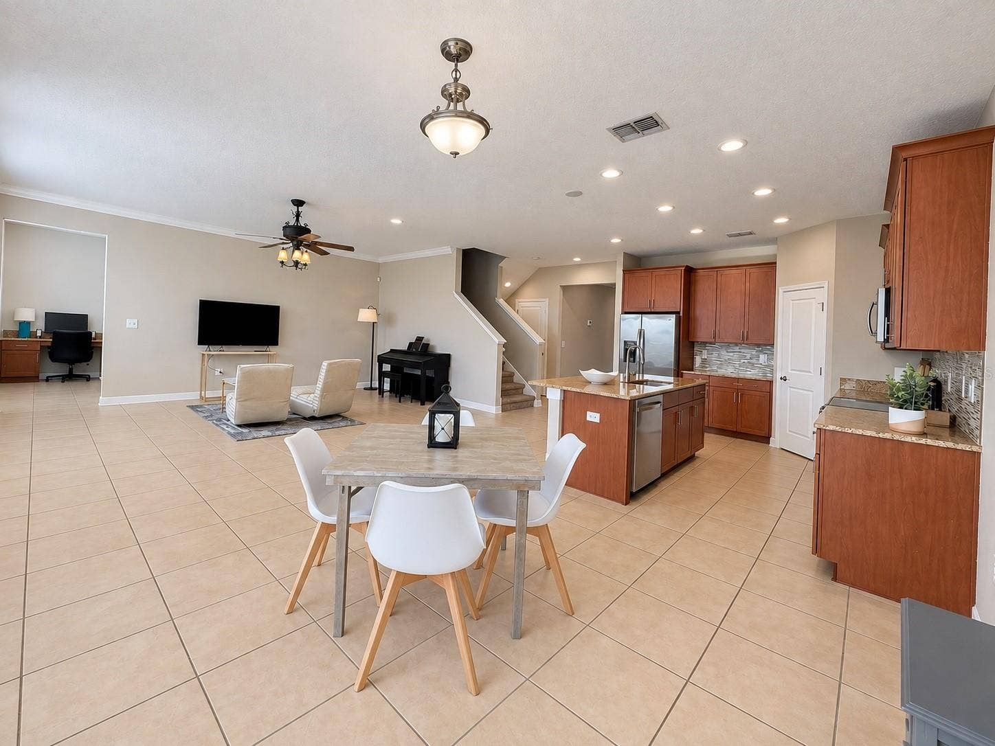 1516 BUNKER DRIVE, Davenport, FL 33896 Open-concept kitchen and living area creates an easy flow for gathering and entertaining.