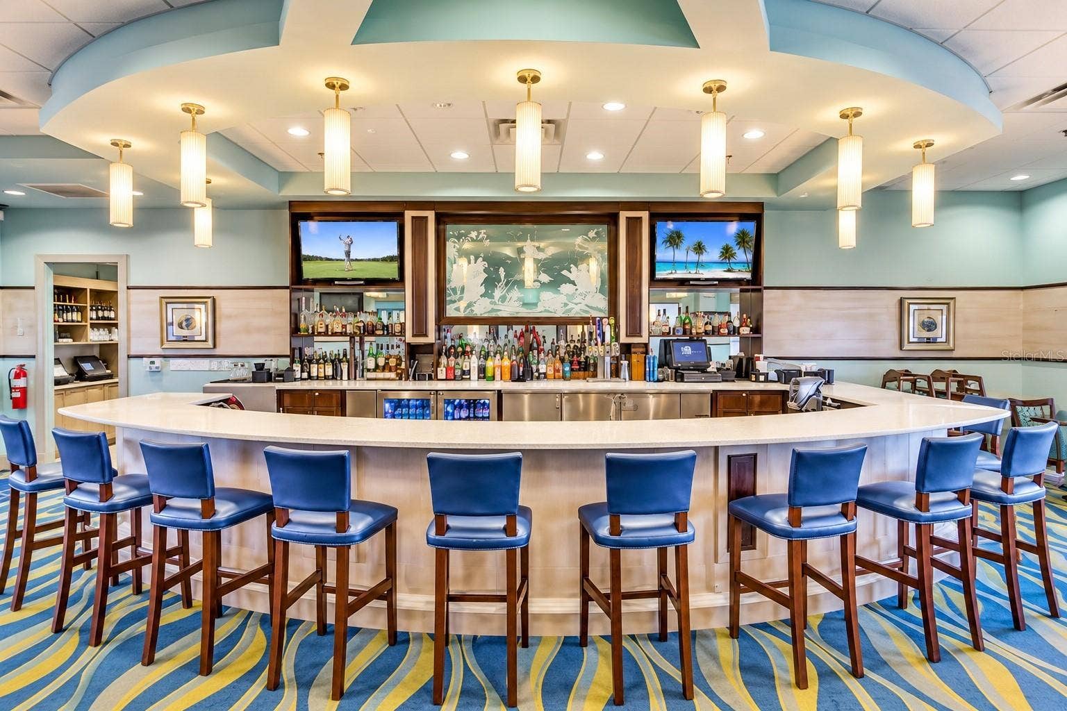 1516 BUNKER DRIVE, Davenport, FL 33896 Spacious clubhouse bar offering comfortable seating and a relaxed resort-style atmosphere.