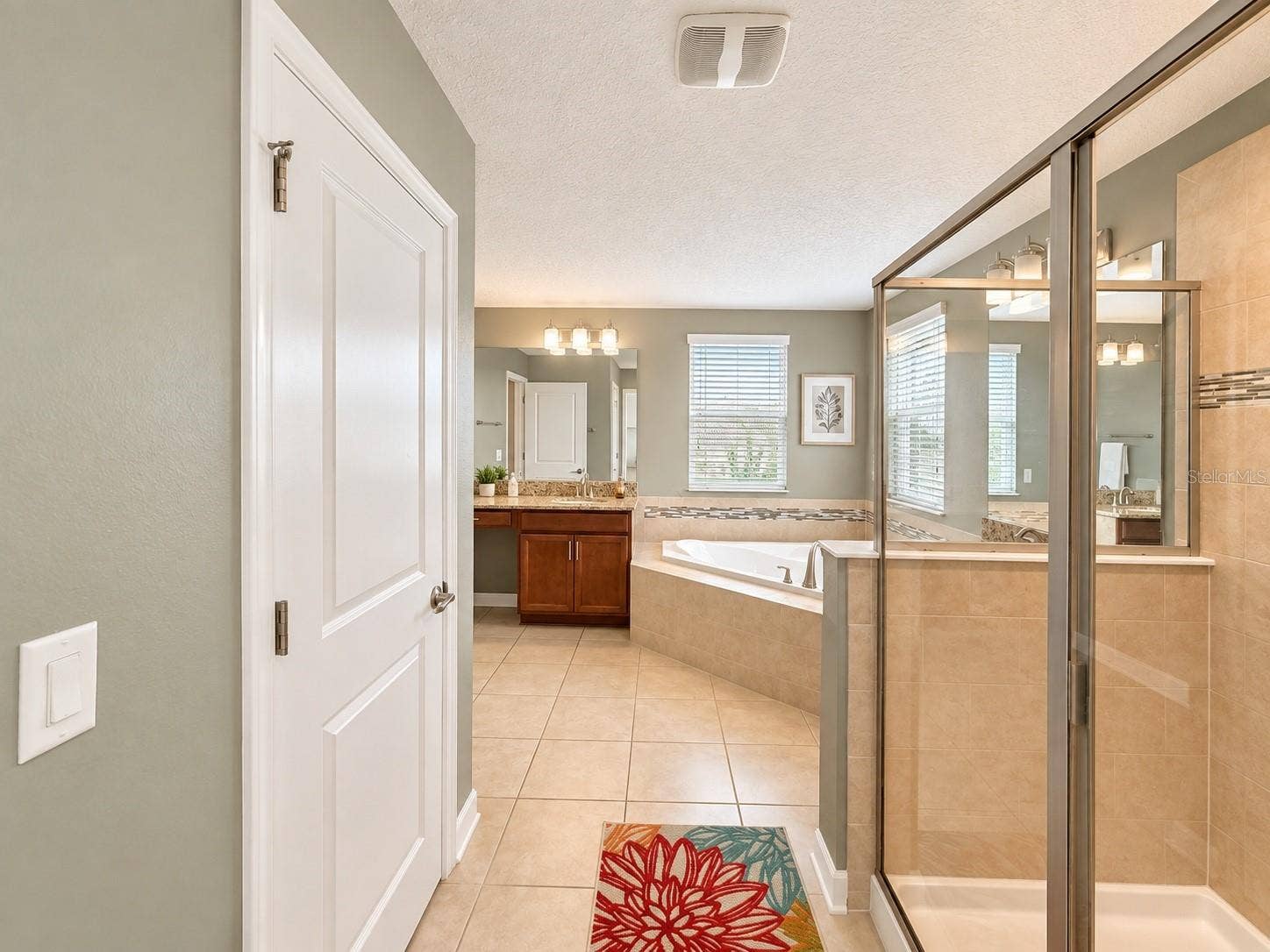 1516 BUNKER DRIVE, Davenport, FL 33896 Generous vanity space provides plenty of room for storage and daily routines.