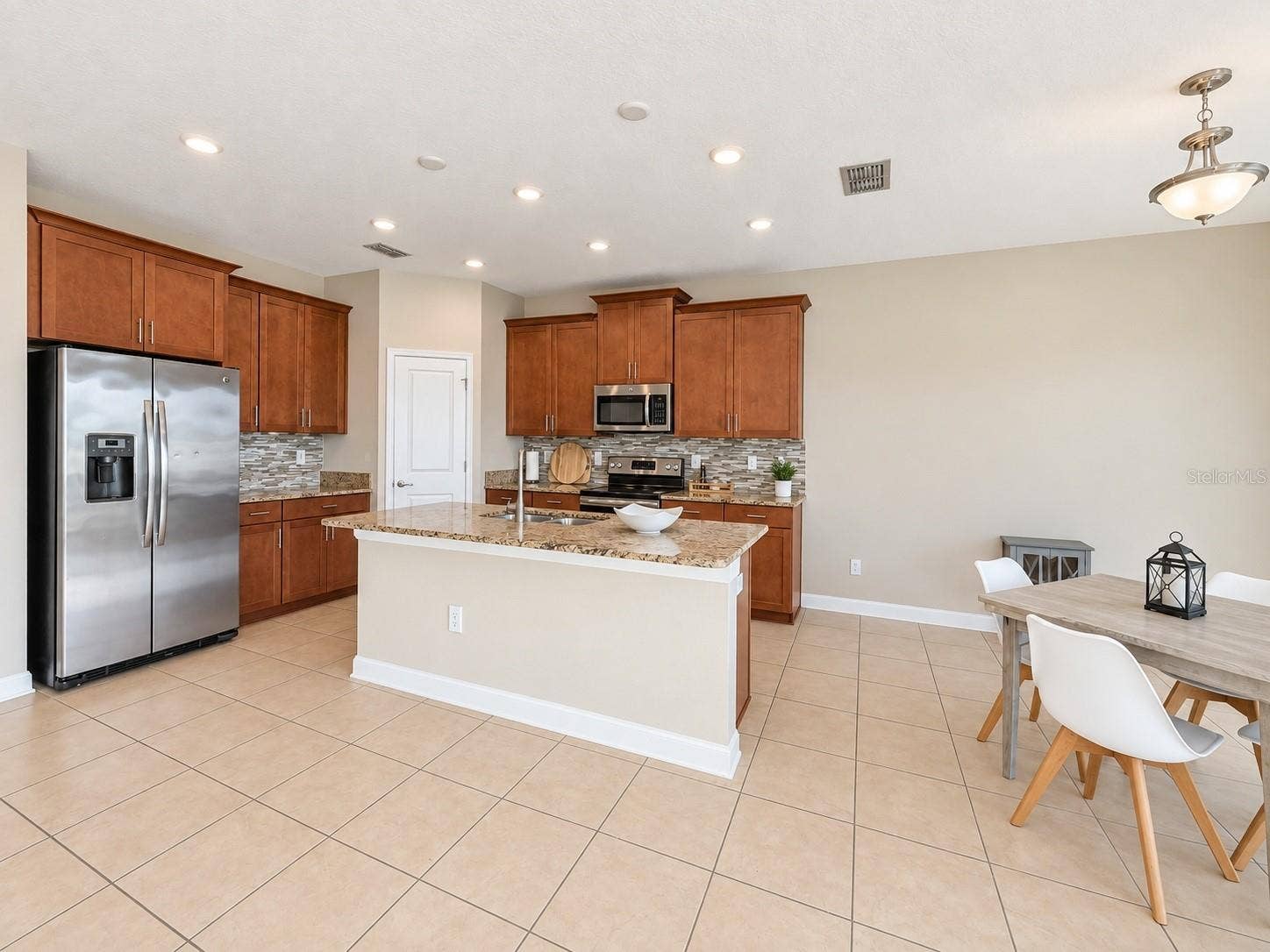 1516 BUNKER DRIVE, Davenport, FL 33896 Open dining space connects naturally with the kitchen and main living areas.